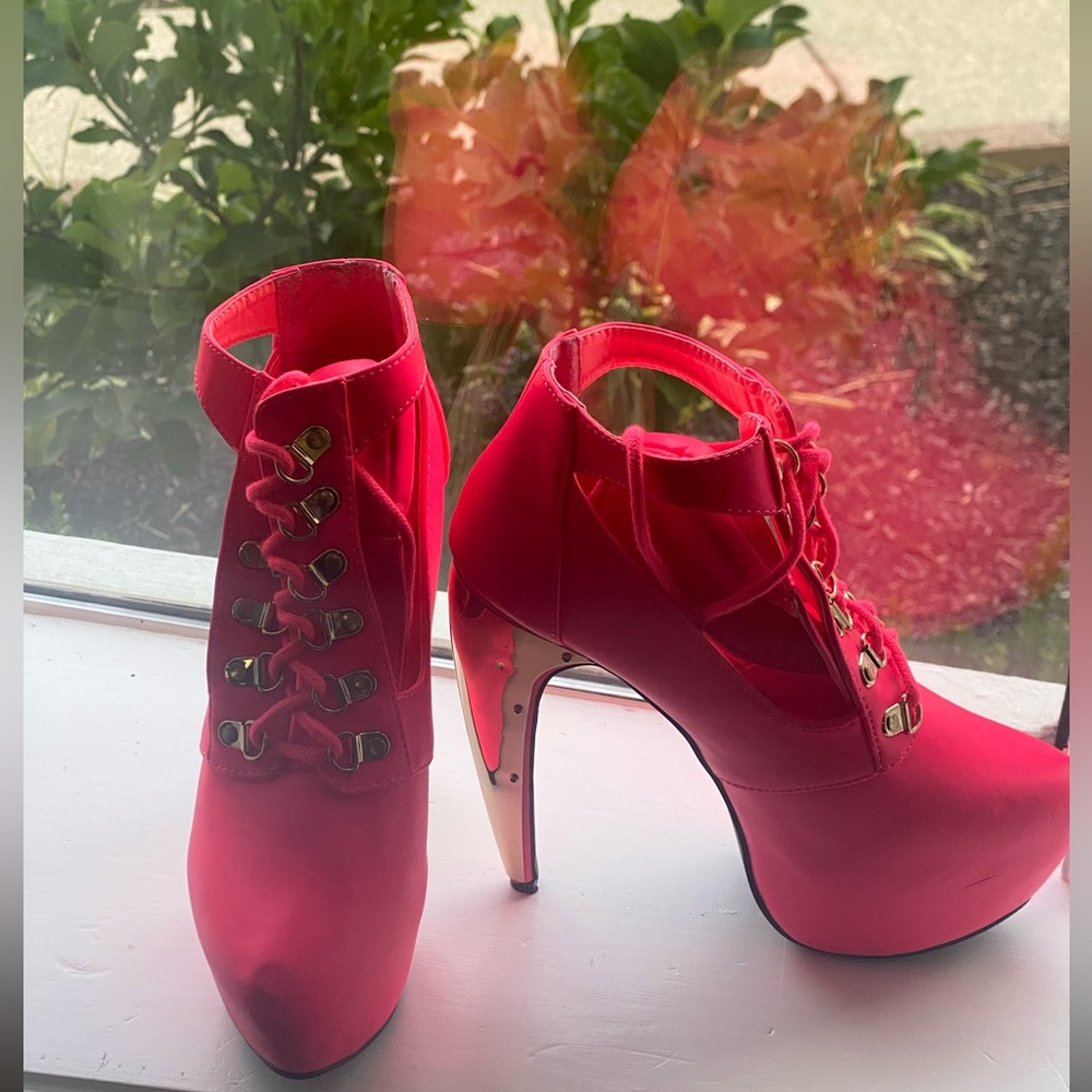 Privileged boots with heel and cut out sides.